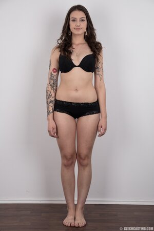 Small-tittied tattooed chick wants to boast about her tattoo sleeve in the studio
