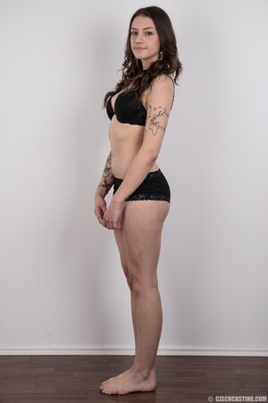 Small-tittied tattooed chick wants to boast about her tattoo sleeve in the studio