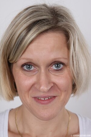 Blonde mature woman in jeans and white lingerie doesn't protect her privacy