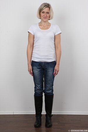 Blonde mature woman in jeans and white lingerie doesn't protect her privacy