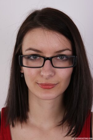 Beautiful young woman with glasses has middle-sized tits that must be free