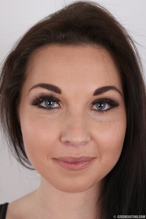 Babe with big eyes and smile receives sexual pleasure from posing naked