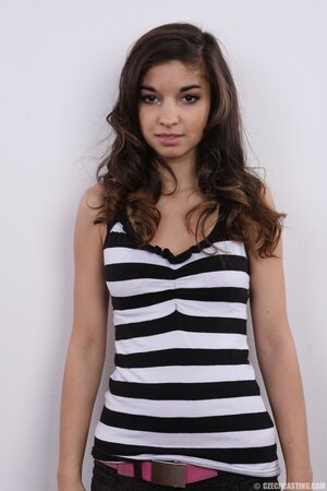 Model takes sweatshirt and striped tunic off continuing with bra and panties