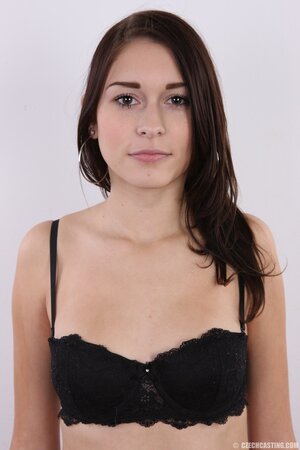 Chick with black eyes unshrouds breasts getting naked in front of the camera