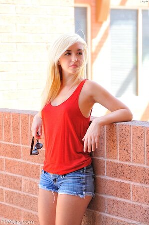 Young woman changes clothes to go playing volleyball in white stockings only