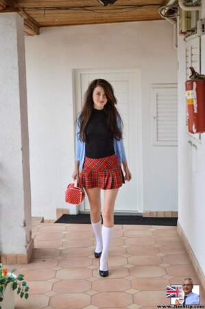 Euro babe in sexy schoolgirl begins shoot by posing naked for mature agent