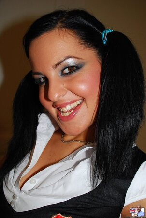 Black-haired sexpot poses on camera before welcoming old man with blowjob