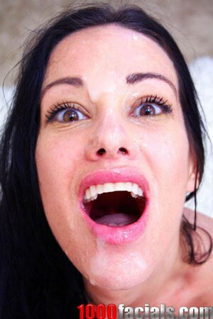 Black-haired MILF with round tits undresses to please guy with blowjob