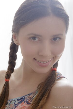 Pretty teen with pigtails and small tits rides masseur's cock after doggy
