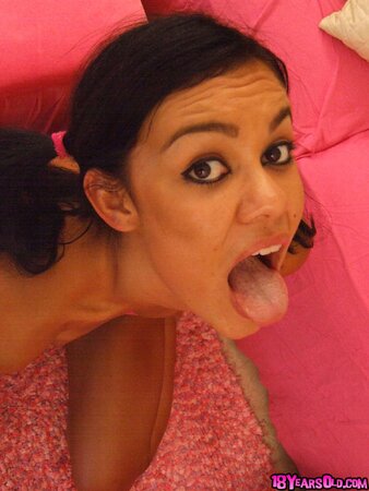 Babe in pink top and green shorts shows off her boobs and gives a blowjob