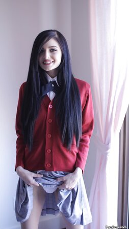 Offensive slut with long black hair flashes her small tits without stripping