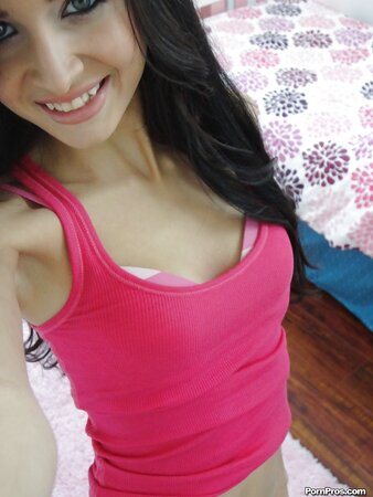 Super-skinny brunette takes pink lingerie off to take sexy selfies