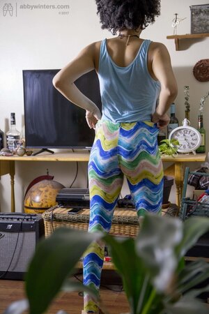 Curvy African chick puts on her cute pink panties and yoga legging