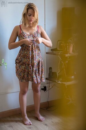 White-skinned Luciana pulls on her red bra and gets fully dressed