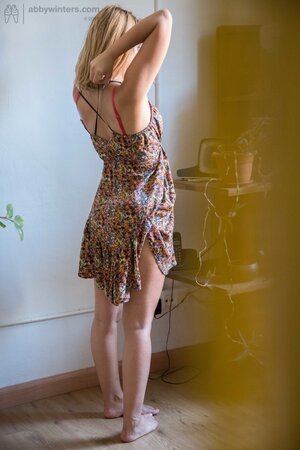 White-skinned Luciana pulls on her red bra and gets fully dressed