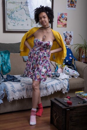 Black babe wearing different socks is obliged to expose boobs with big nipples