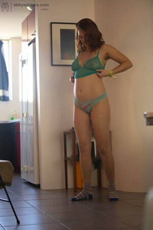 Perverted guy takes pictures of the adorable stepsister putting on the clothes