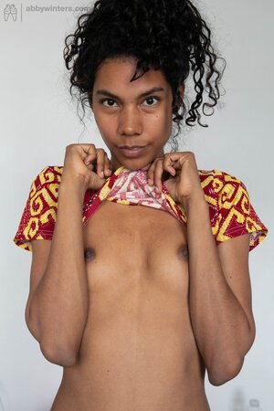 Ebony girl with sticking out ribs changes outfit and exposes her hairy muff