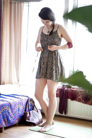 Young woman can't hide her small tits from camera before she wears dress and hat