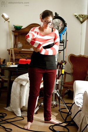 Sensuous female with glasses has a hot body but she hides it under the outfit