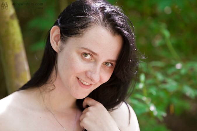 Brunette woman walks in the forest and sudden desire to masturbate fills her