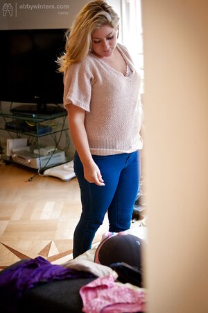 Slut gets dressed starting with bra and finishing with tight blue jeans