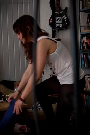 Young Bea pulling up green panties and tights after posing naked