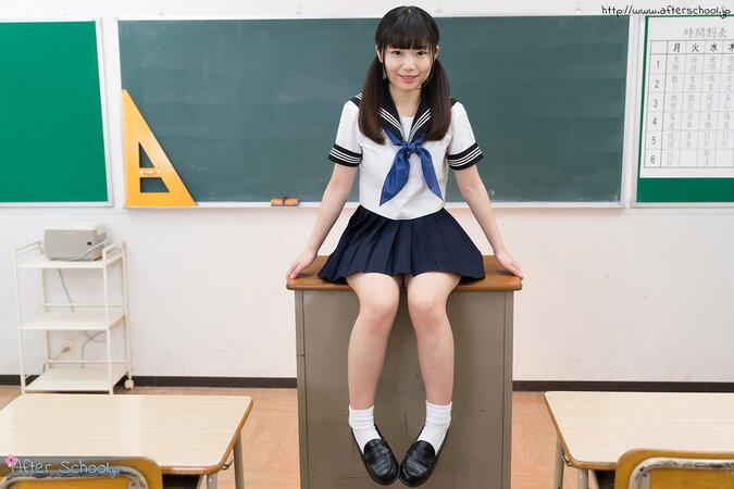 Japanese schoolgirl takes off her panties to show up her shaved cunt