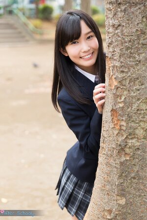 Japanese schoolgirl takes off her panties and shows up her butt in the class