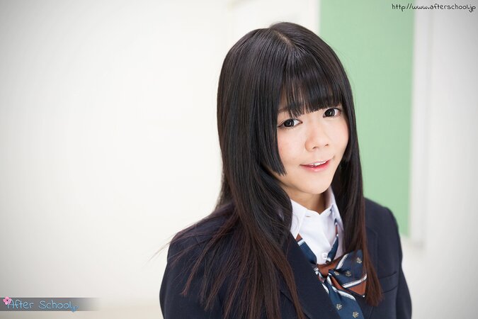 Young Japanese girl gets naked looking into the camera with her eyes full of lust