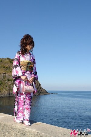Asian slut knows her business and walks down the ocean shore attracting boys