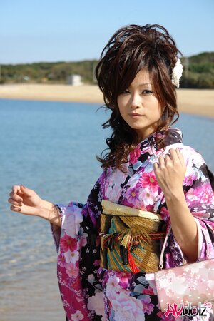 Asian slut knows her business and walks down the ocean shore attracting boys