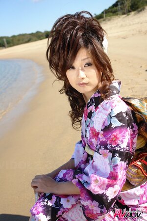 Asian slut knows her business and walks down the ocean shore attracting boys
