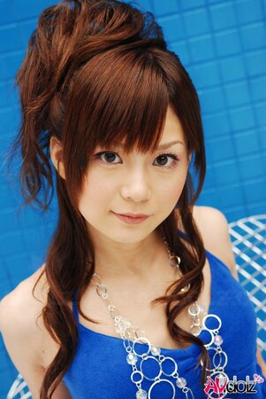 Skinny Japanese teen poses on cam somewhere in private swimming pool