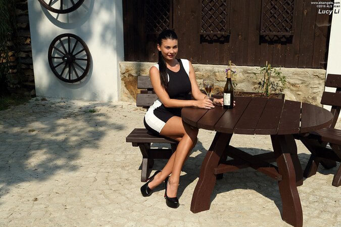 Bottle of wine and pussy spreader should help busty brunette receive pleasure