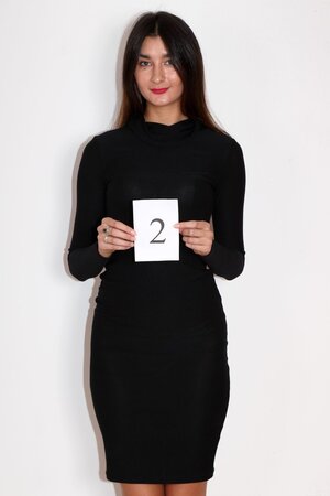 Beautiful tall model disrobes tight black dress to show up on the camera