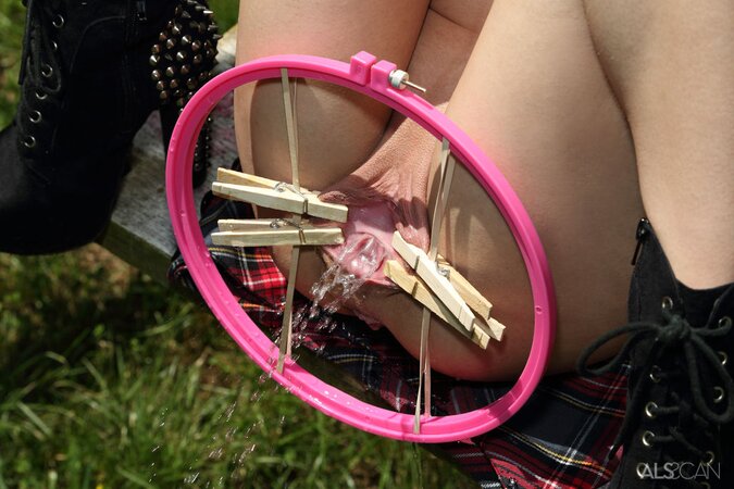Pigtailed college girl in boots has fun with pussy spreader sitting on swing