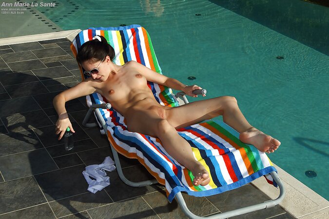Whore plays dirty games on the chaise lounge stripping in front of another female