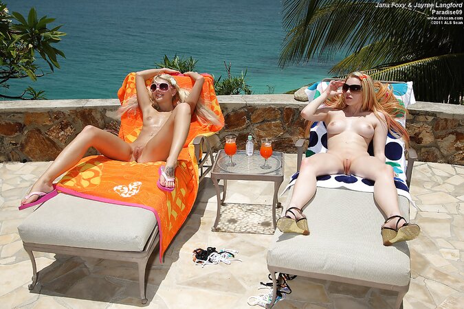 Slutty lesbians pull swimming suits down to play with pump on the lounge chair