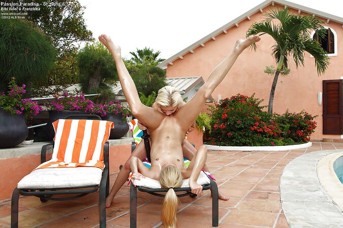 Attractive blondes lick each other's moist cunny outdoors on deck chairs