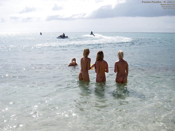 Six good-looking chicks have a lot of fun on the beach near restless ocean