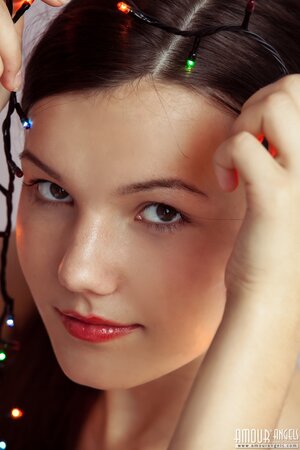 Good-looking chick Rogned strips naked to fool around with Christmas lights