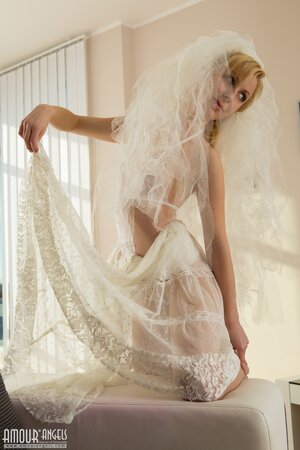 Bride with blonde hair and blue eyes will surprise her groom with naked pics