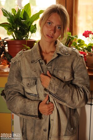 Skinny blonde wakes up and goes in the garden to play with her pretty cat