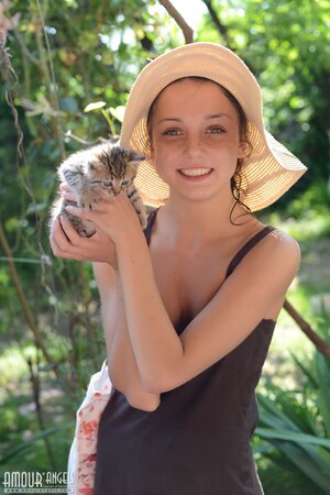 Teen sweetie with freckled face likes to walk without clothes on the beach