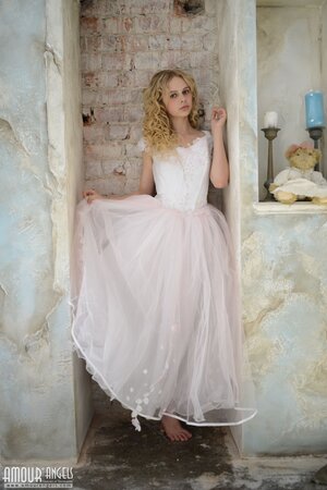 Before wedding ceremony enticing blonde performs strip show in abandoned chapel