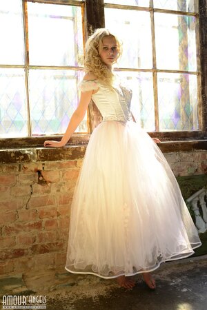 Before wedding ceremony enticing blonde performs strip show in abandoned chapel