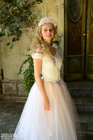 Before wedding ceremony enticing blonde performs strip show in abandoned chapel