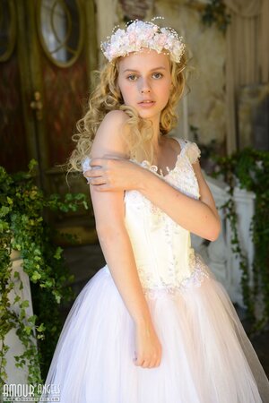 Before wedding ceremony enticing blonde performs strip show in abandoned chapel