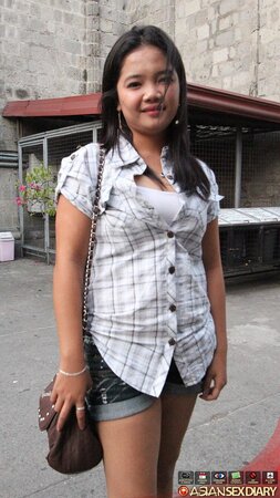 Asian chick in a checkered shirt sucks and gives hairy cunt to boy for drilling